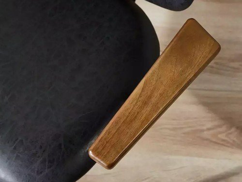 Poltrona Sucre tapizada con apoyabrazos y base metálica negra